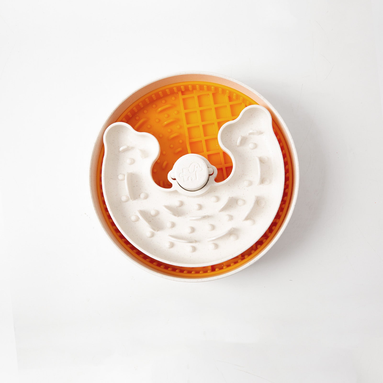 A round orange and white interactive pet feeder with a waffle-like design and a central bone-shaped detail, this puzzle bowl is perfect for engaging your furry friend.