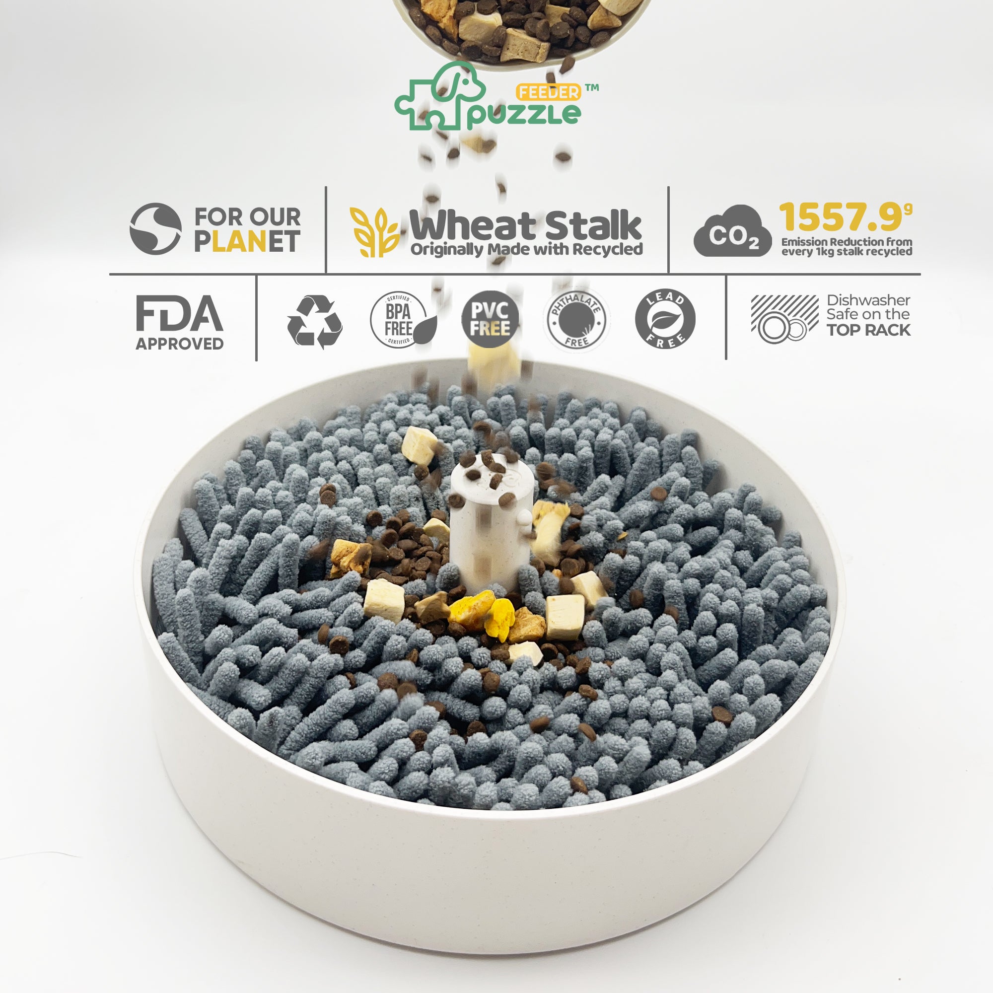 A white, circular Puzzle Feeder™ pet food bowl filled with gray kibble-like pieces features a central column and falling food pieces. Surrounding text highlights the environmental benefits, safety certifications, and dishwasher safety of this product. The Dog Sniffing Mat Accessory from Puzzle Feeder™ not only replaces slow feeding bowls but also serves as an anxiety-reducing solution for pets.