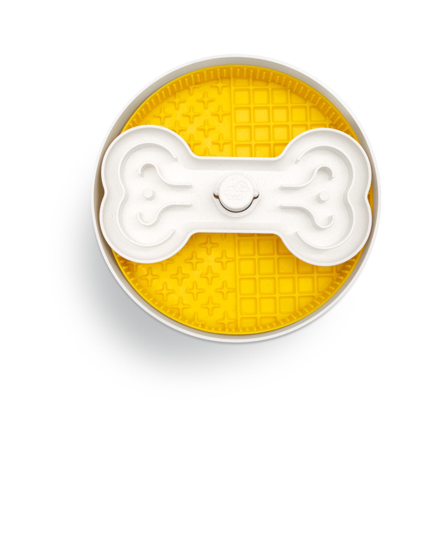 Circular pet feeding dish with a yellow textured base and a removable bone-shaped insert in the center.