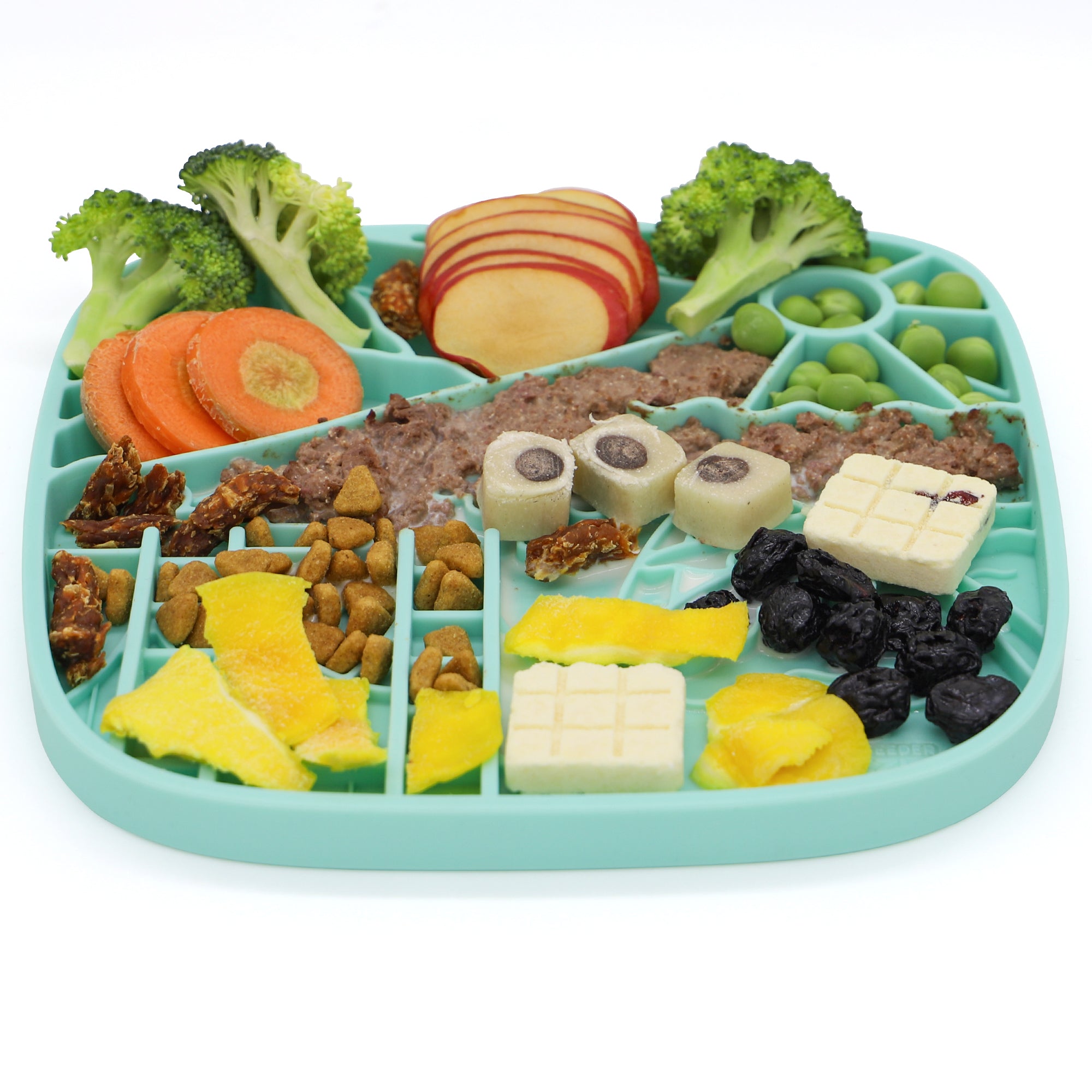 The California Themed Lick Mat by Puzzle Feeder™ features a teal design that offers spaces for broccoli, apple slices, carrots, peas, cubes, dried fruit, and nuts. This slow feeding mat is crafted to encourage healthy eating and digestion.