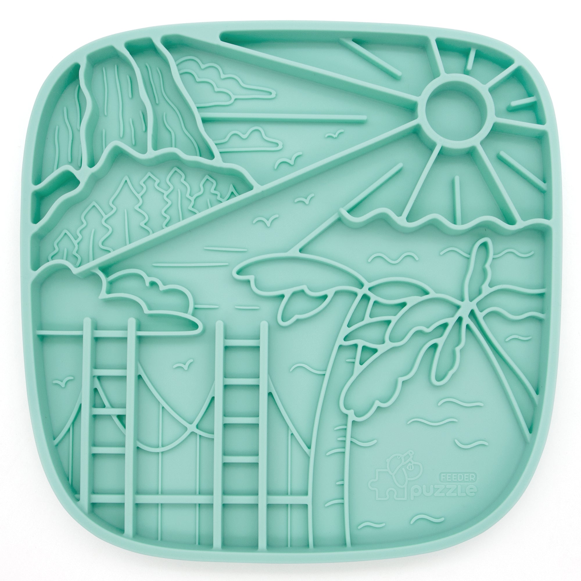 The Puzzle Feeder™ California Themed Lick Mat is a teal silicone slow feeding mat showcasing a tropical landscape with sun, palm trees, mountains, and clouds. It promotes healthy digestion while adding a Golden State vibe to meals.