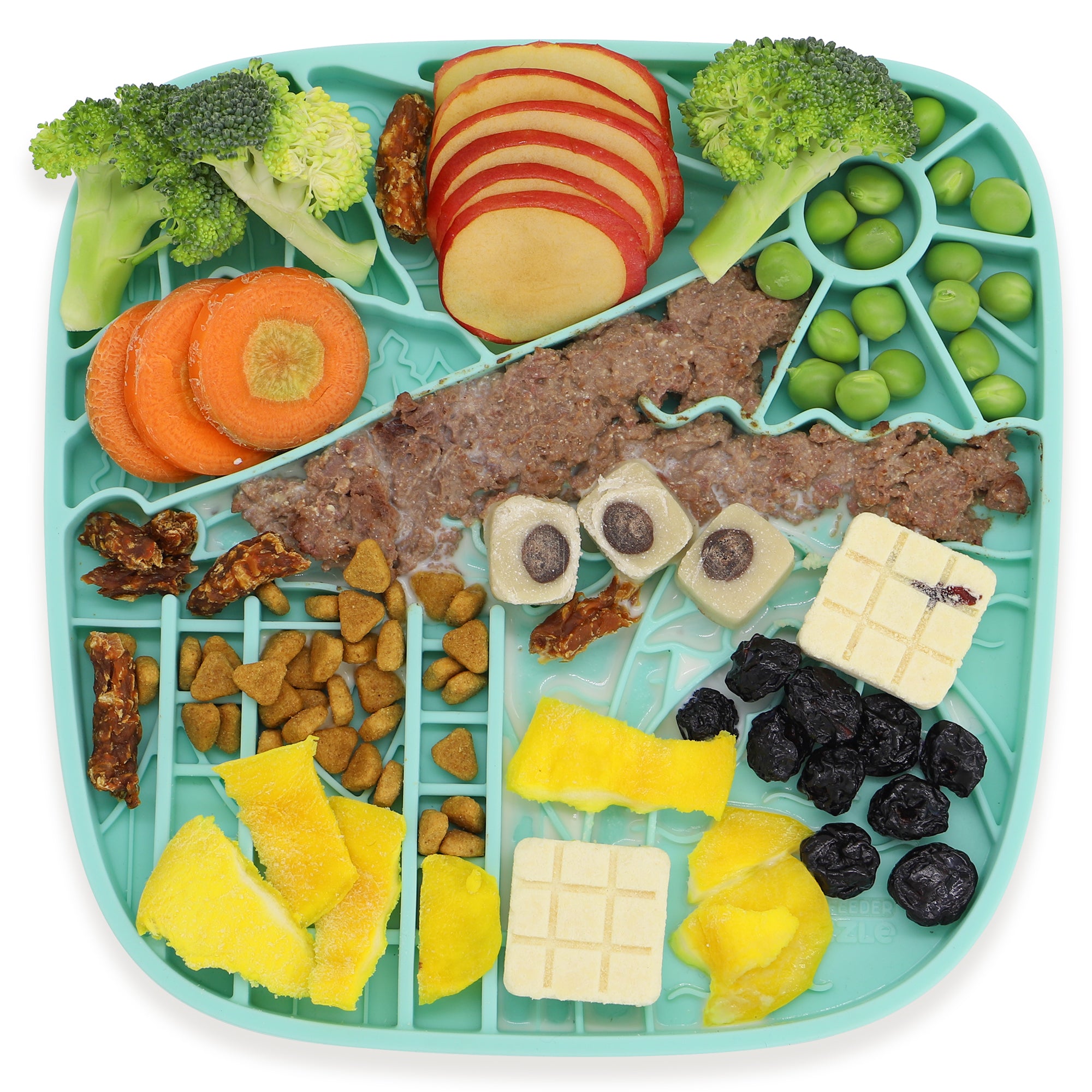 Puzzle Feeder™'s California Themed Lick Mat is designed for slow eating and healthy digestion, featuring apple slices, broccoli, carrots, peas, dried fruits, freeze-dried cubes, yellow pieces, and brown kibble in a California-inspired style.